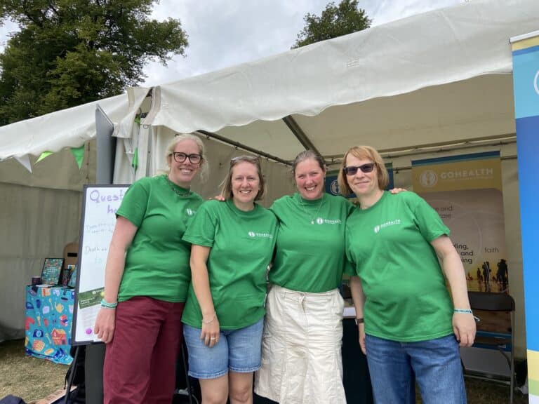 Gohealth team at greenbelt in front of the tent