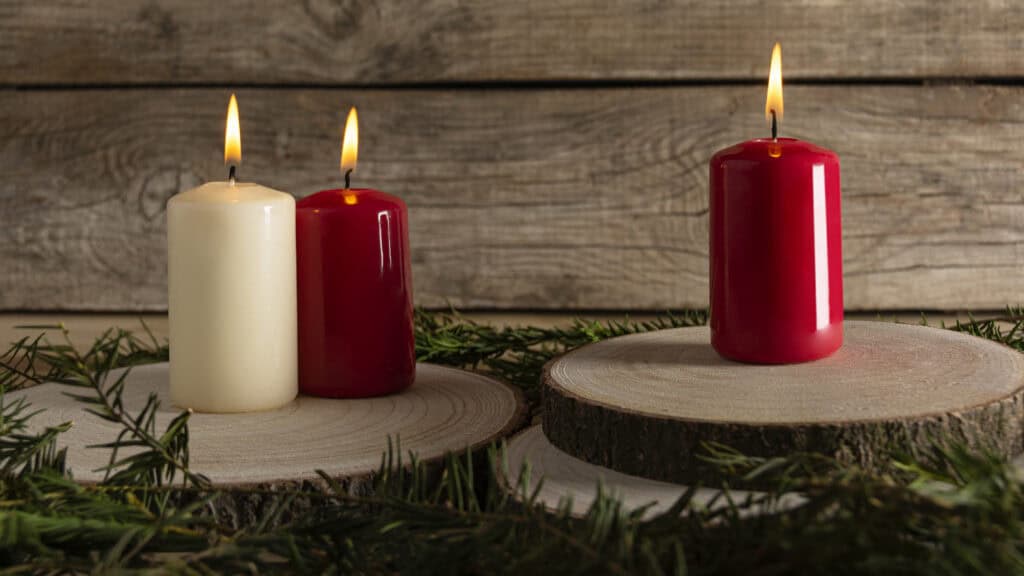 three candles on bits of wooden
