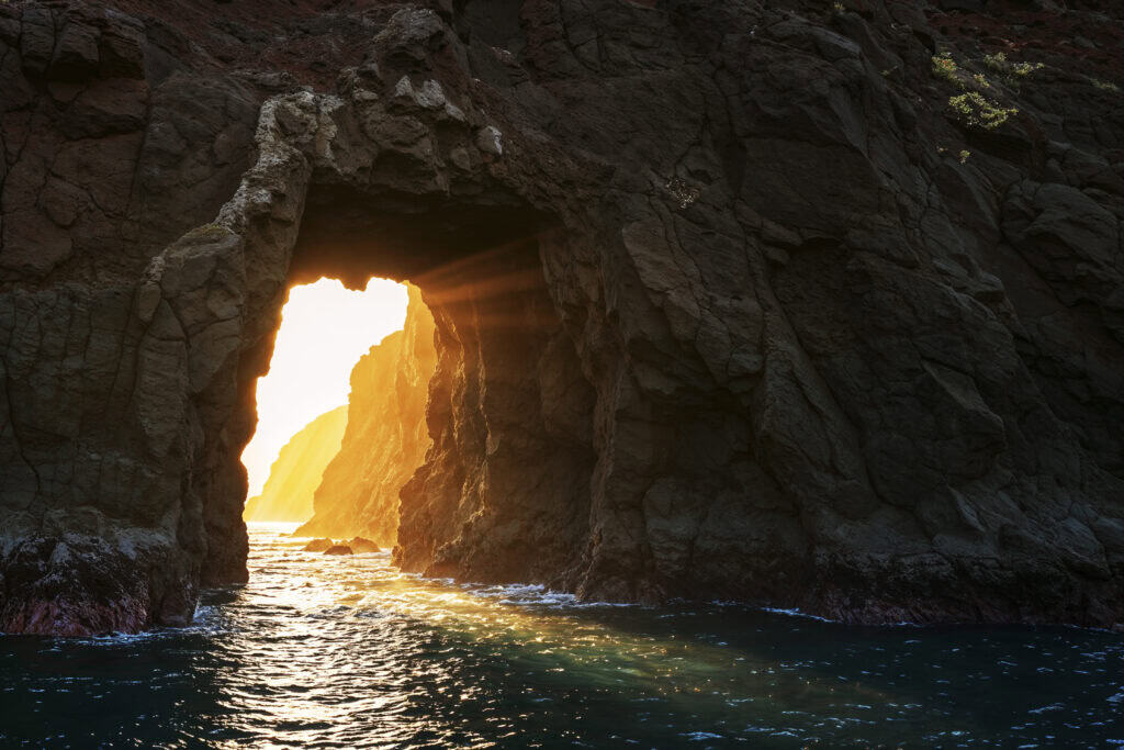 a cave with light flowing in